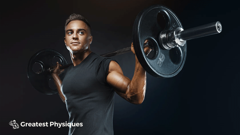 Muscular athlete prepares to back squat with a barbell in the gym