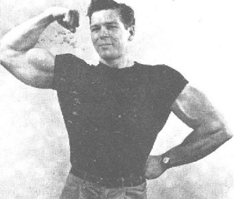 Bruce Randall flexing his biceps