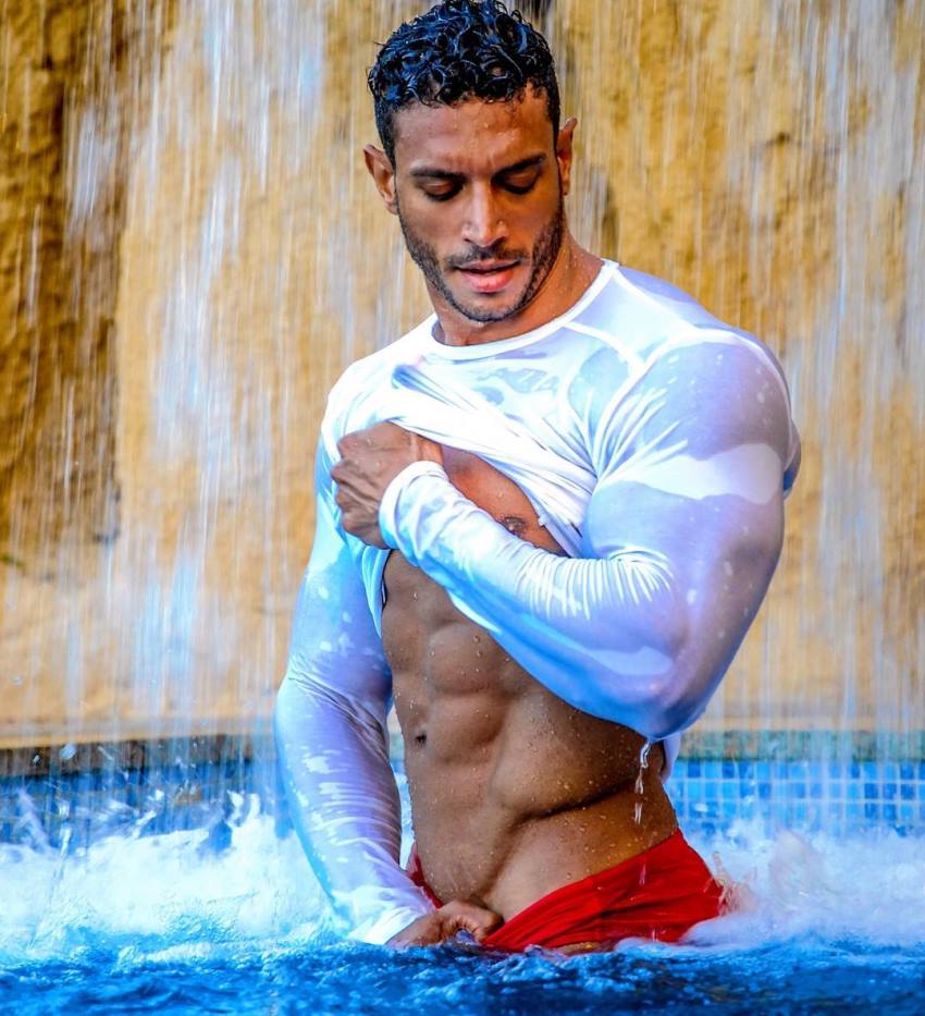 Hany Saeed doing a male modeling photo shoot looking ripped and muscular