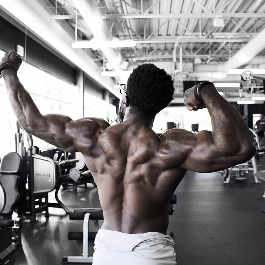 Kizzito Ejam showing off his back muscles.