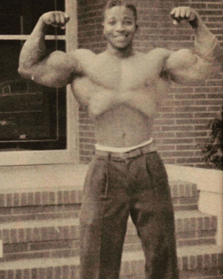 Leroy Colbert flexing his biceps.