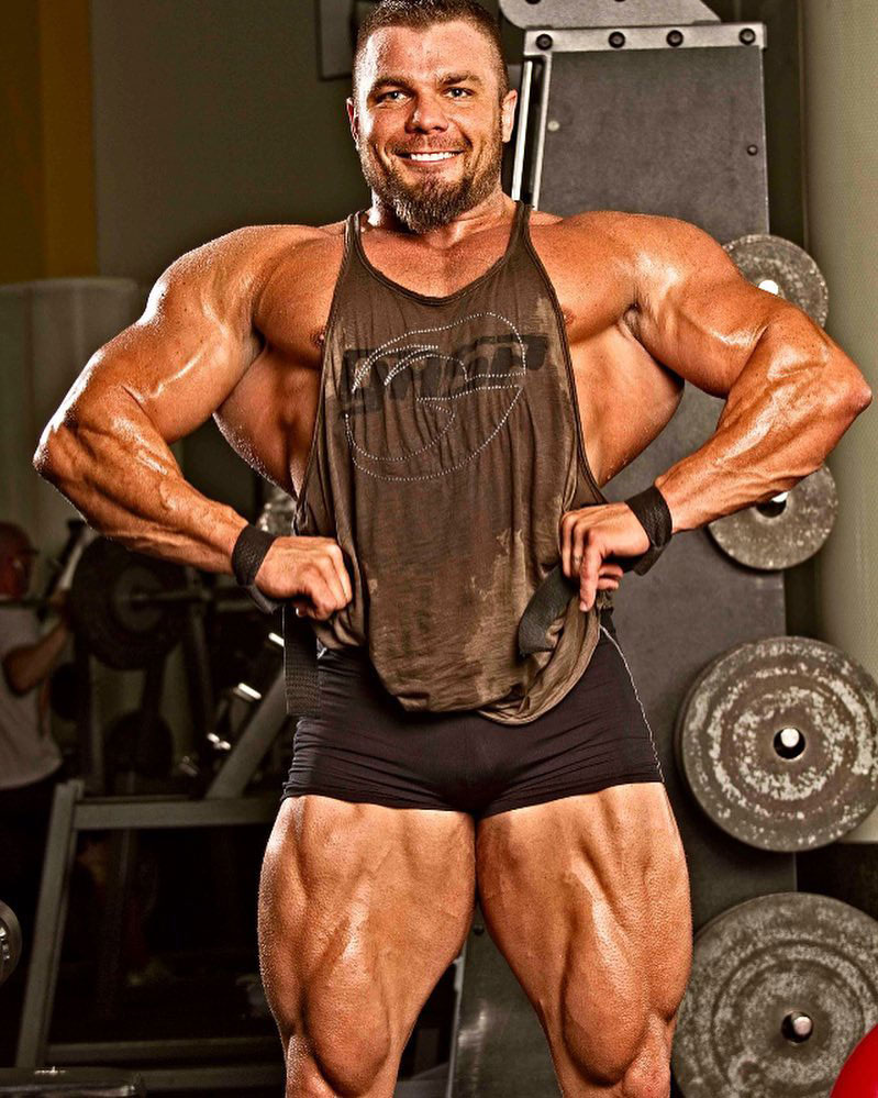 Mike Johnson showing off his huge arms in a photo shoot.