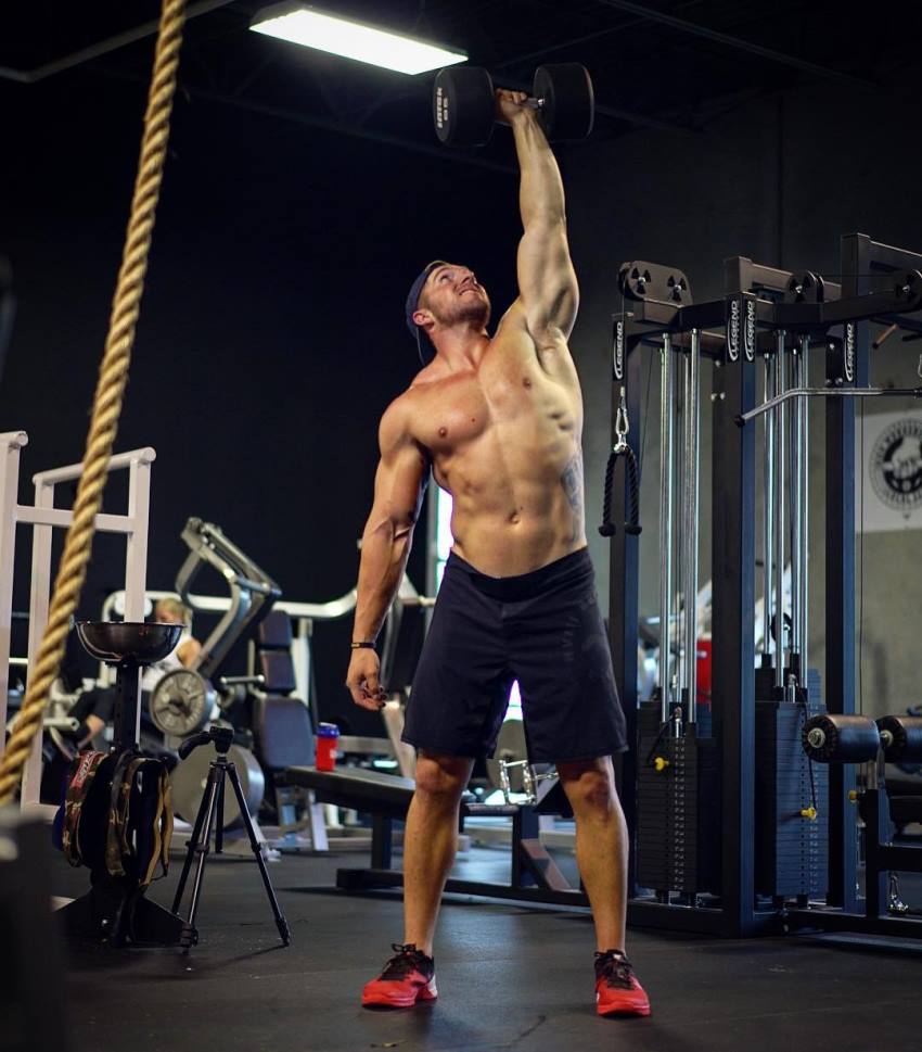 Nick Bare doing kettlebell training in a gym