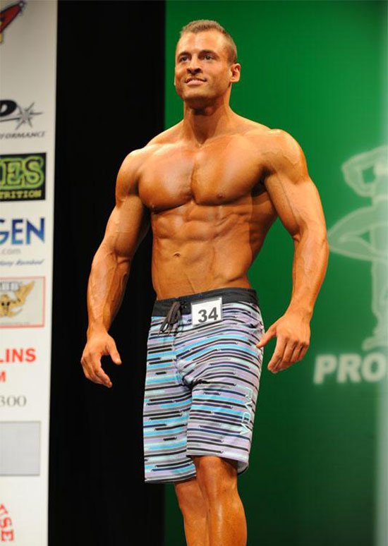 Ryan Hughes on the bodybuilding stage.