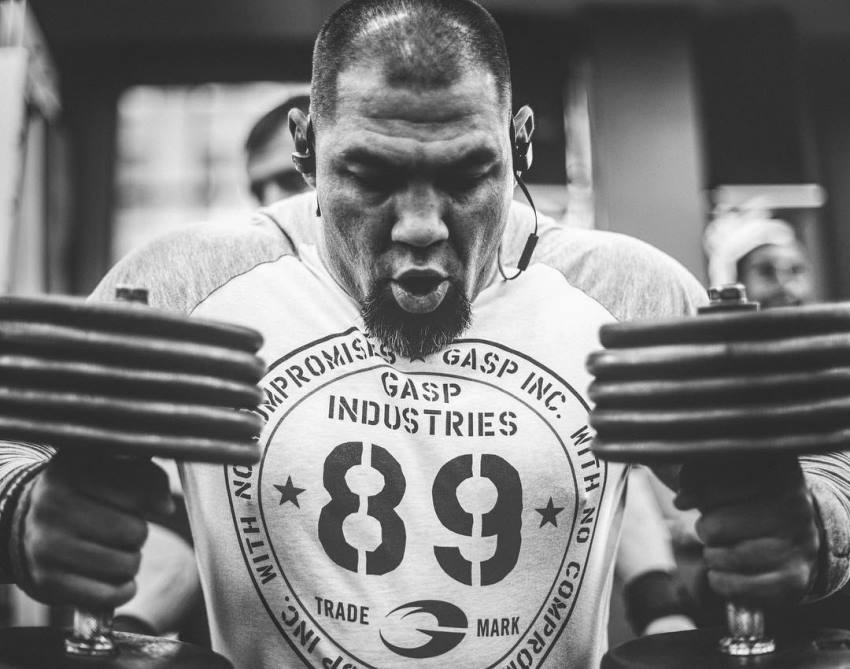 Tony Sentmanat preparing to do a heavy dumbbell lift in the gym