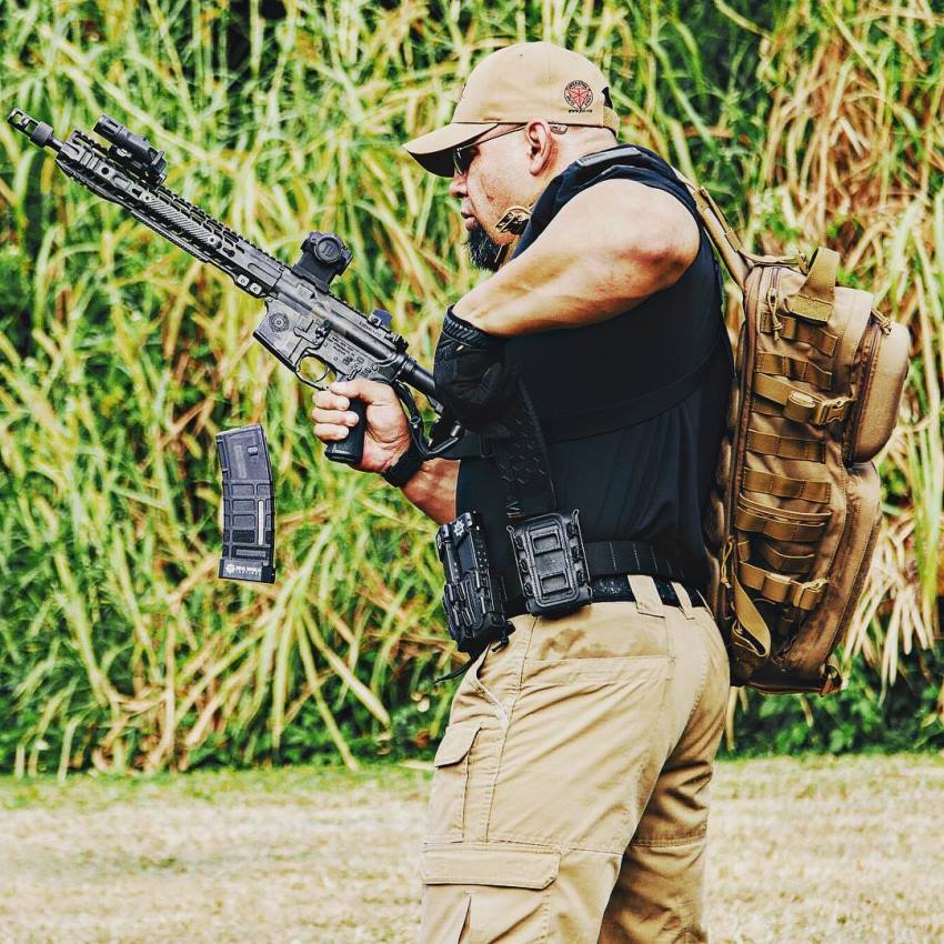 Tony Sentmanat reloading a rifle while practicing real-life combat skills