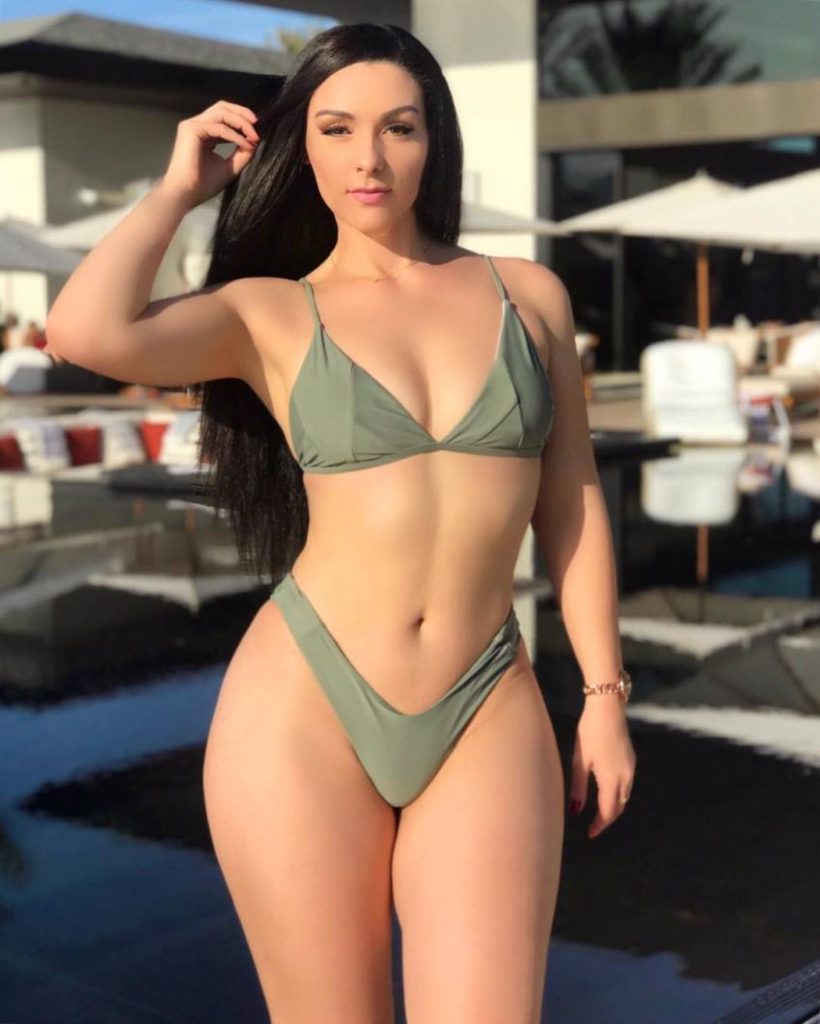 Viktoria Kay posing for a photo looking curvy and fit 