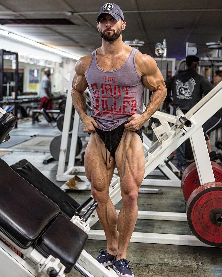 Julian Smith flexing his legs for the photo looking ripped