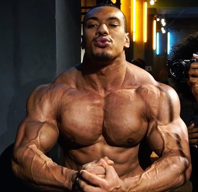 Larry Wheels doing a most muscular pose looking big