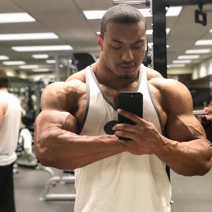 Larry Wheels taking a selfie of his muscular physique