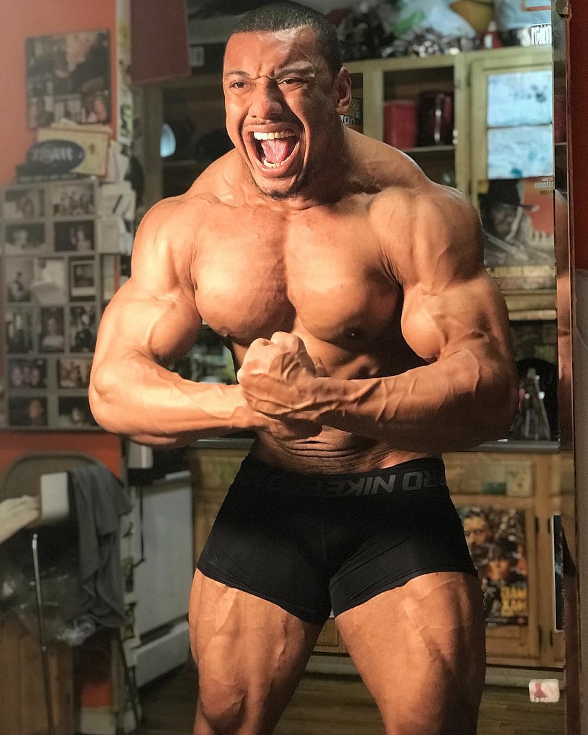 Larry Wheels doing a most muscular pose looking big