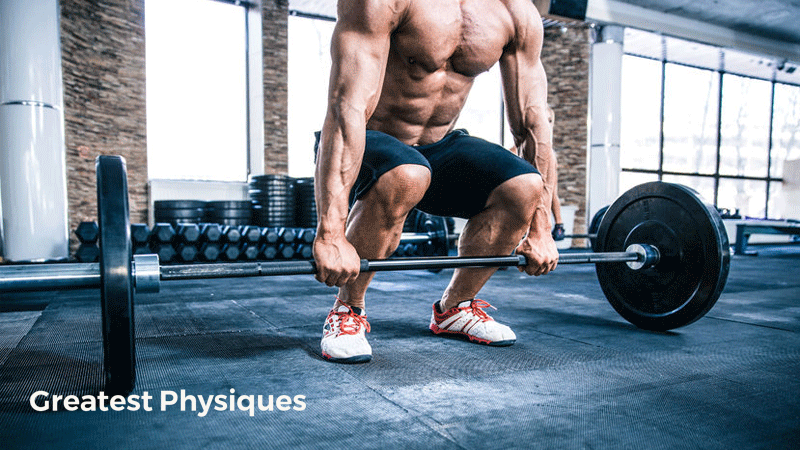 Male athlete setting up for a deadlift, showing off his muscles in the gym