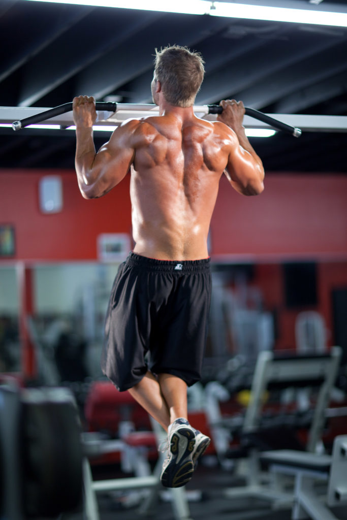 Ben Booker doing pull-ups in a gym