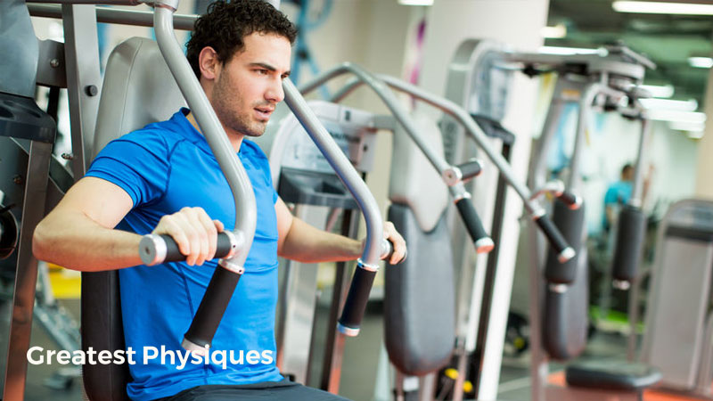 young male athlete lifting weights on the chest press