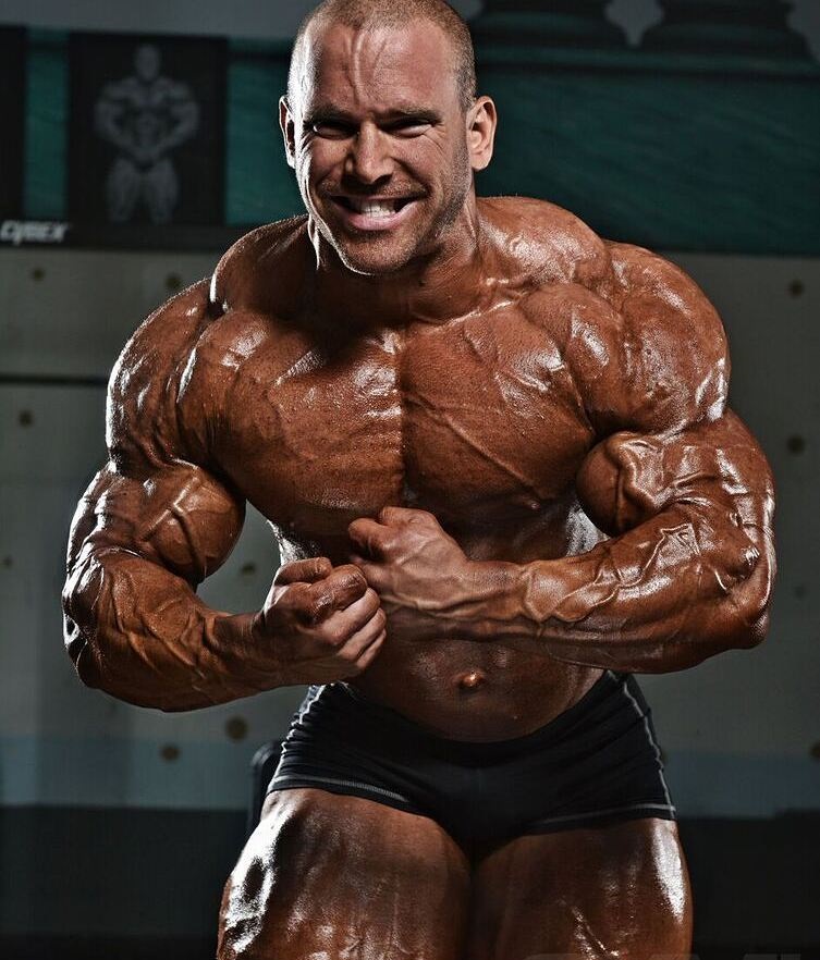 Jordan Janowitz showcasing his most muscular pose in a photo shoot