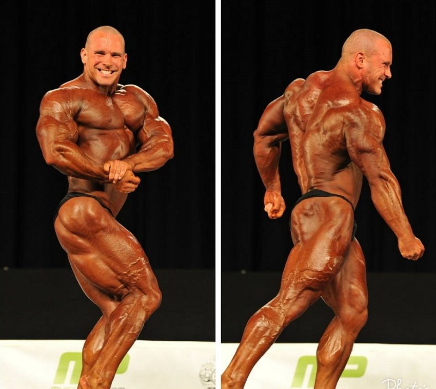 Jordan Janowitz competing on the bodybuilding stage showing off his conditioned physique