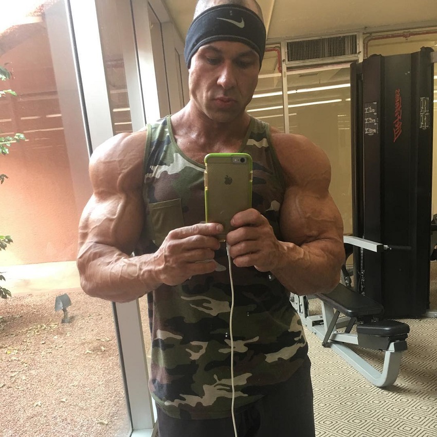 Matt Porter taking a selfie of his ripped and muscular arms