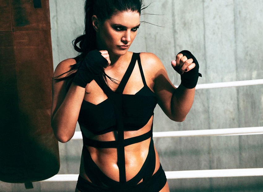 Gina Carano posing in a photo shoot, standing in a boxing stance