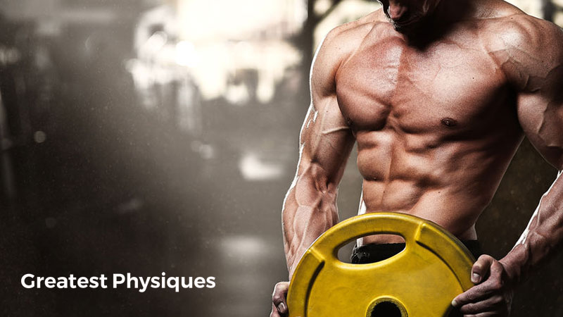 Muscular, lean man over 40 lifting a yellow weight plate onto a bar in the gym