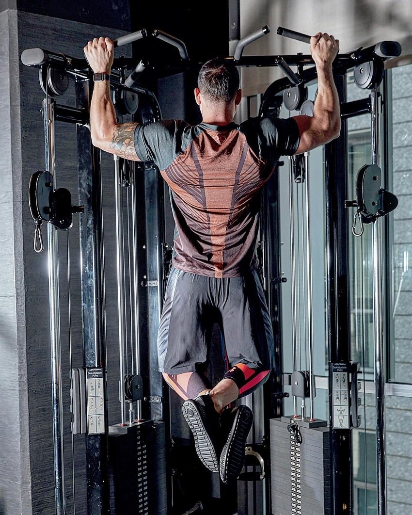 Rob Sharpe doing pull-ups in a gym