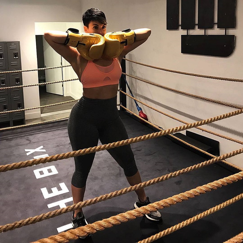 Zahra Elise standing in a boxing ring looking fit and curvy
