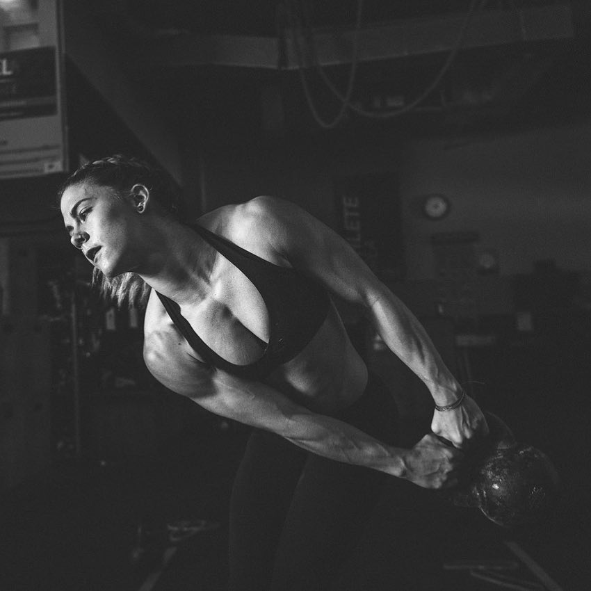 Alison Scudds holding a kettlebell as a part of a photo shoot