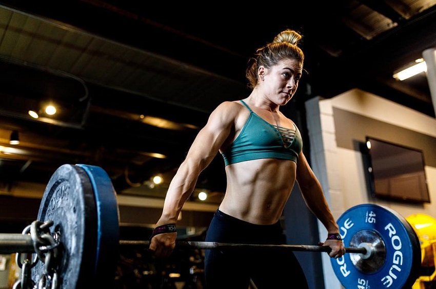 Alison Scudds lifting a barbell loaded with weights