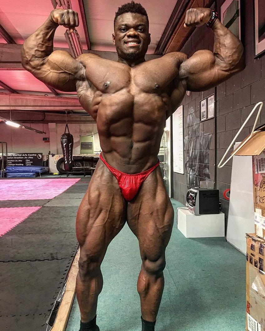 Blessing Awodibu doing a front double biceps pose in a photo