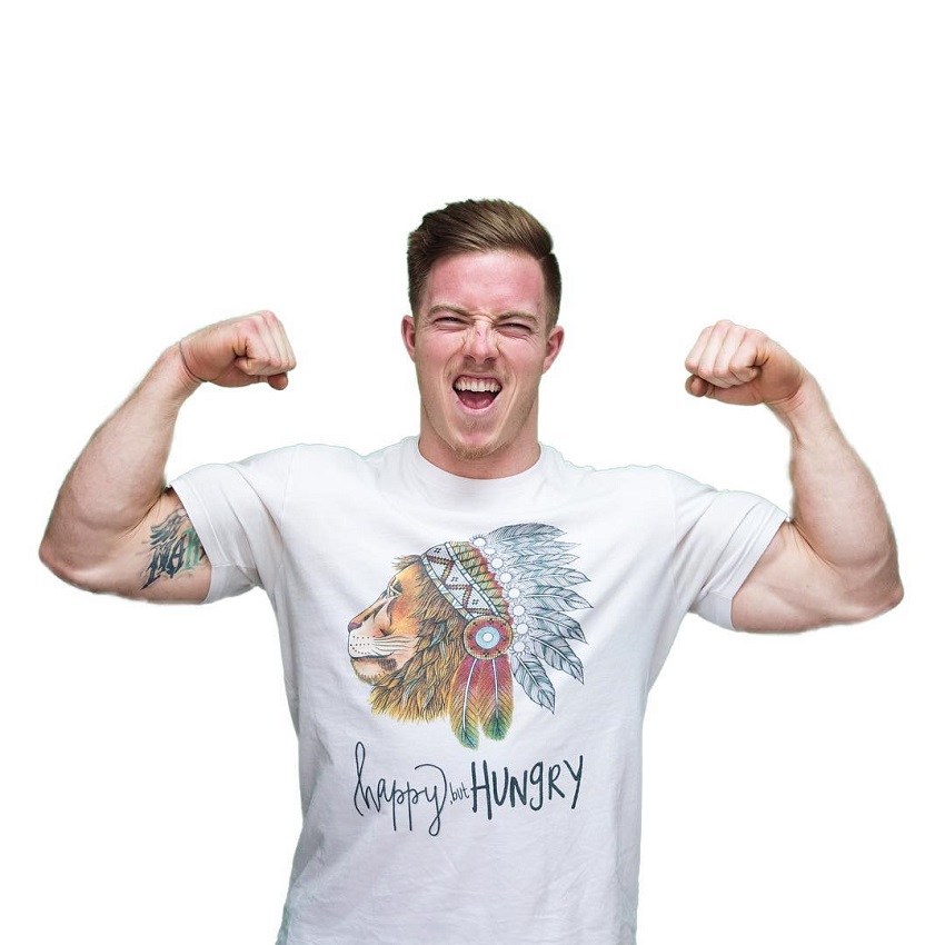 Noah Ohlsen doing a front double biceps pose in a white t-shirt