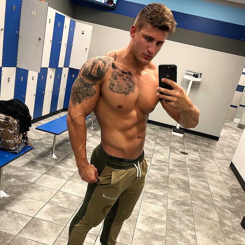 Quinn Biddle taking a selfie of his shirtless and muscular physique