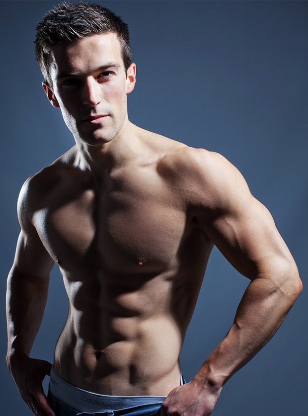 Scott Baptie posing shirtless in a modeling photo shoot