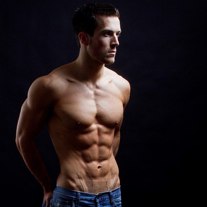 Scott Baptie posing shirtless in a photo shoot