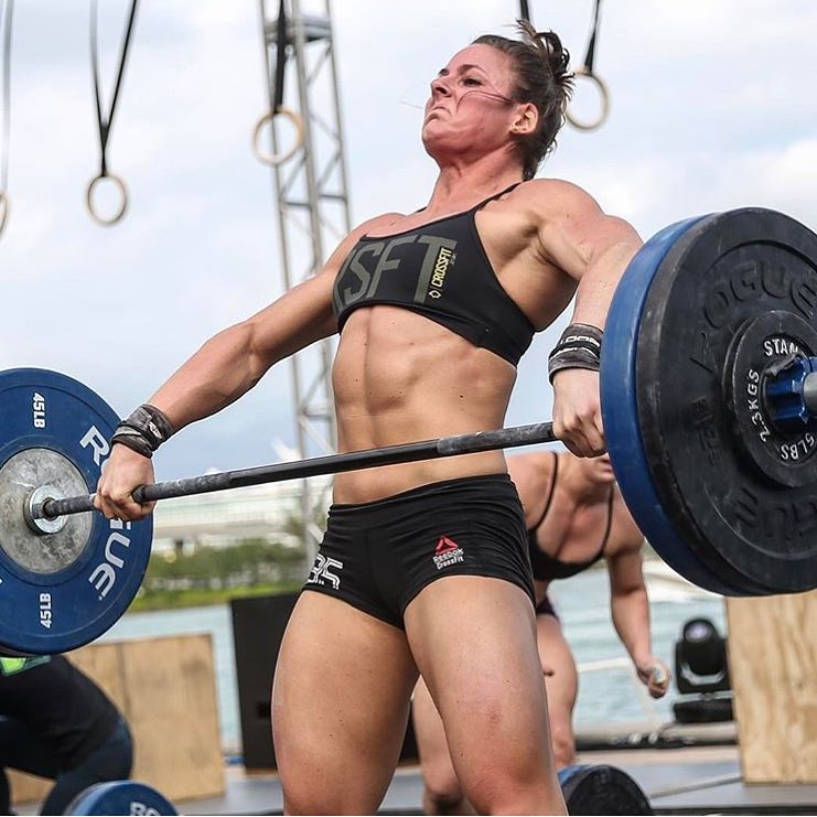 Stacie Tovar lifting heavy barbell during a CrossFit contest