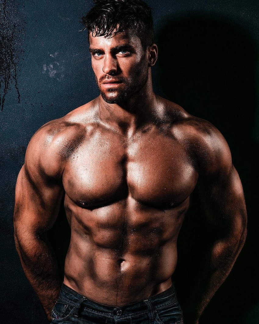 Thomas Canestraro posing shirtless in a modeling photo shoot