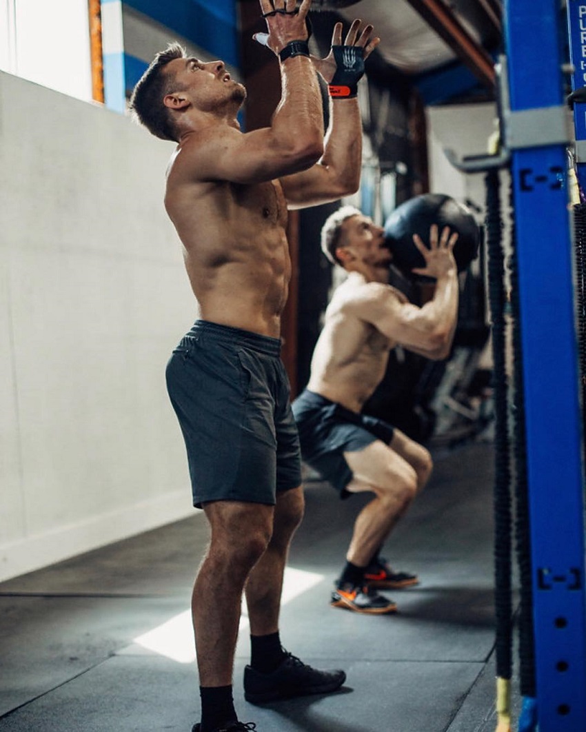 Alex Anderson performing a bag exercise during CrossFit training