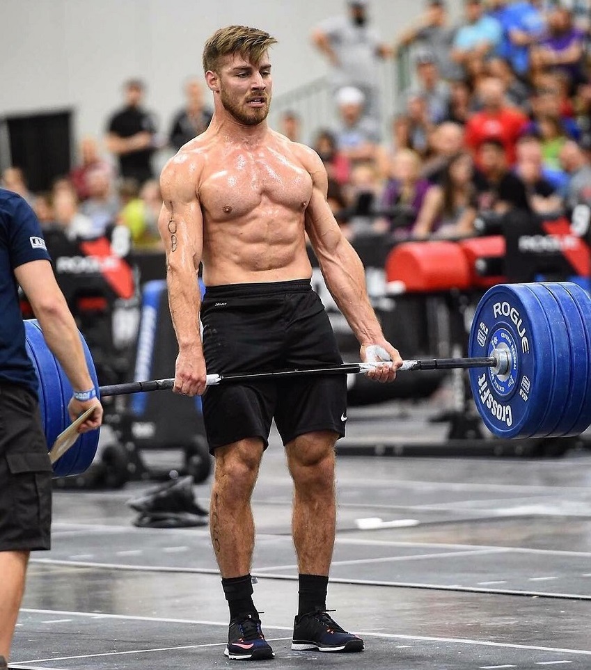 Alex Anderson lifting heavy barbell deadlifts during a CrossFit event