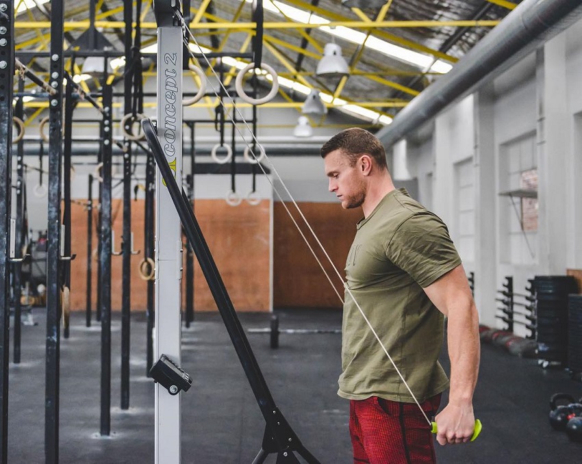 Chad Mackay doing triceps cable extensions looking lean and strong