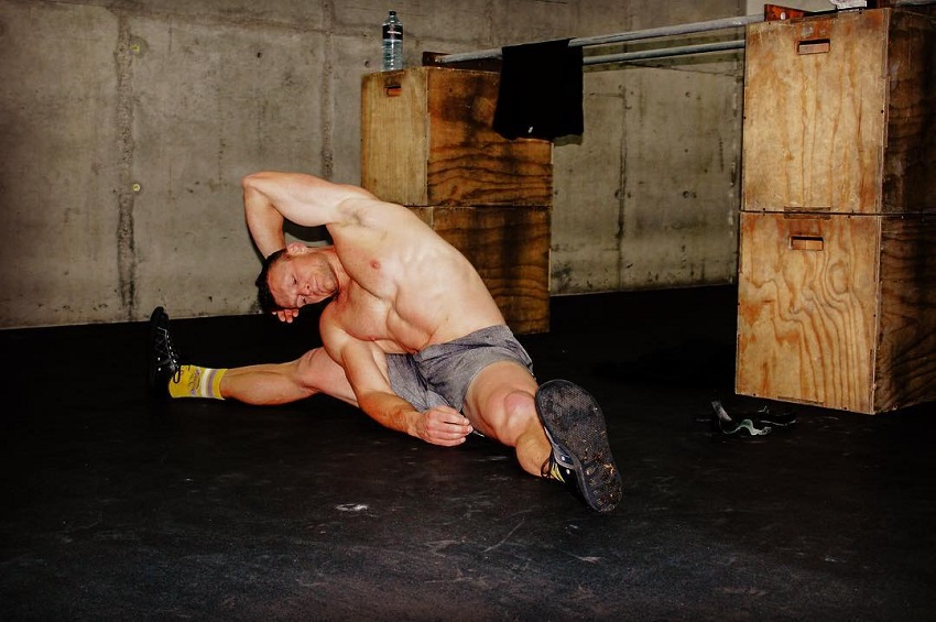 Chad Mackay stretching after his intense training in CrossFit