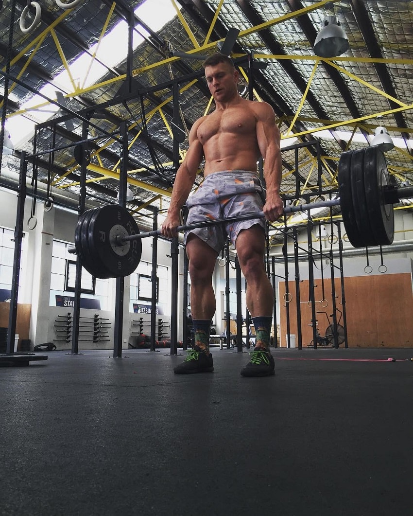 Chad Mackay doing heavy deadlifts in a CrossFit gymnasium