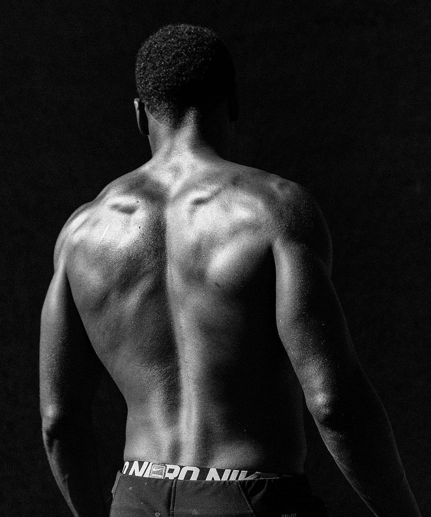 Joe Holder showing his muscular back in a photo shoot