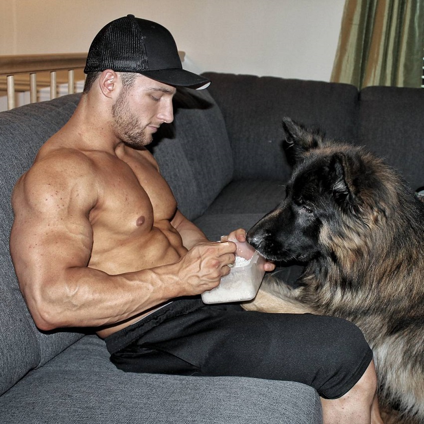 Jonathan Plante sitting on a couch with his dog
