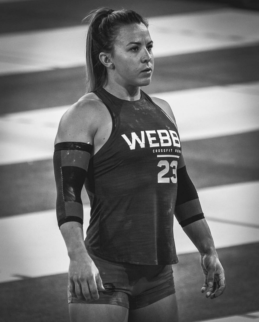 Kara Webb Saunders standing on a track during a CrossFit contest, looking strong and healthy