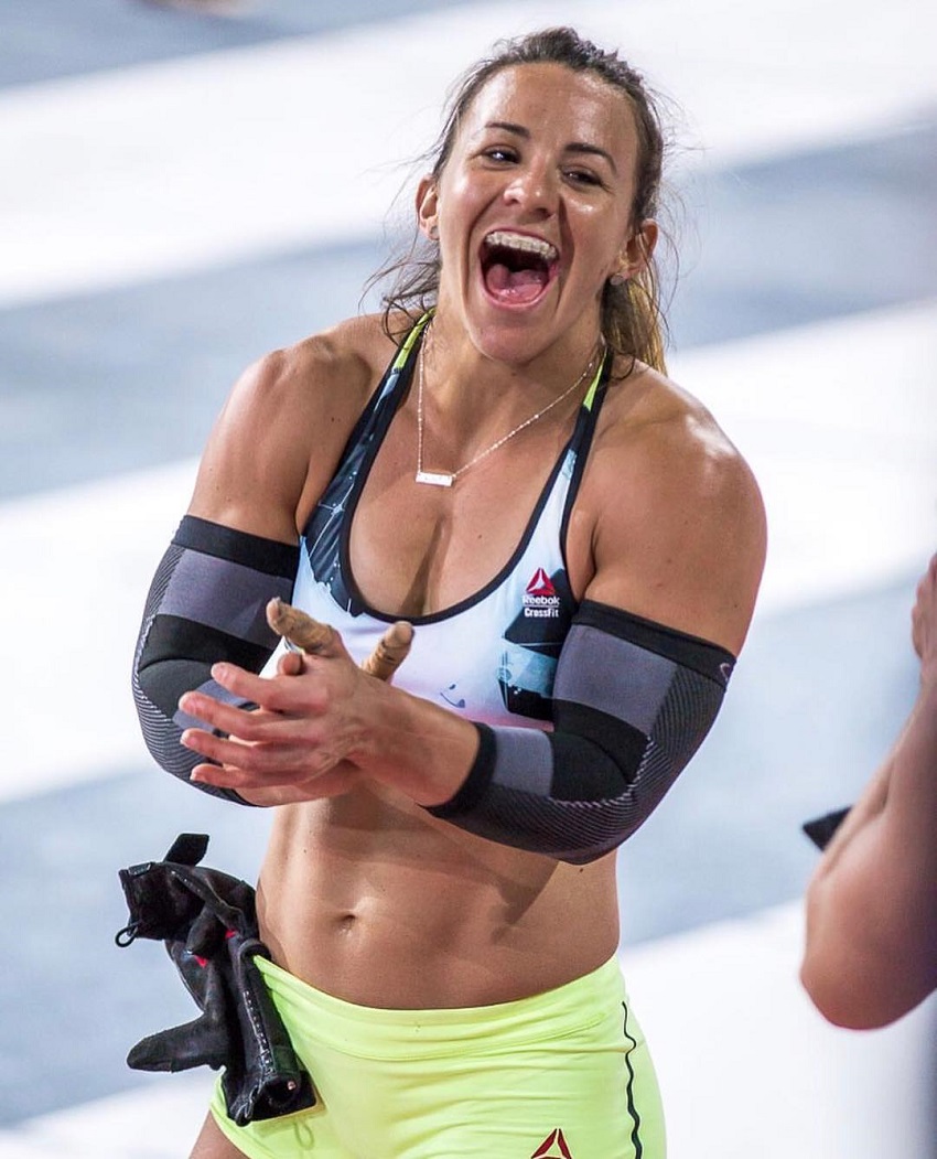 Kara Webb Saunders clapping and smiling during a CrossFit contest