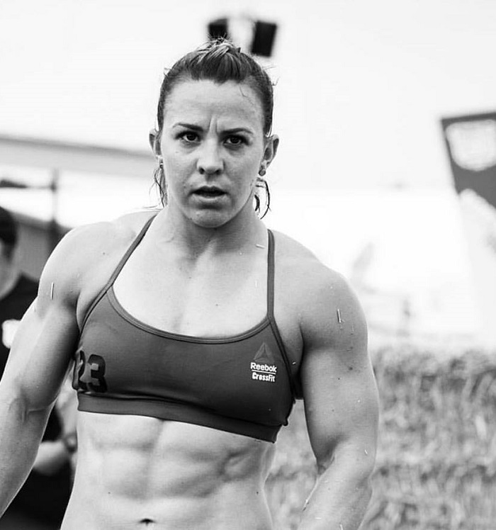 Kara Webb Saunders during a CrossFit competition her abs looking ripped