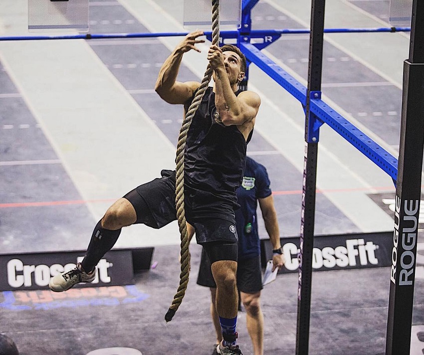 Khan Porter climbing rope in a CrossFit event