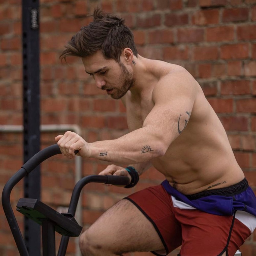 Khan Porter training on a stationary bike