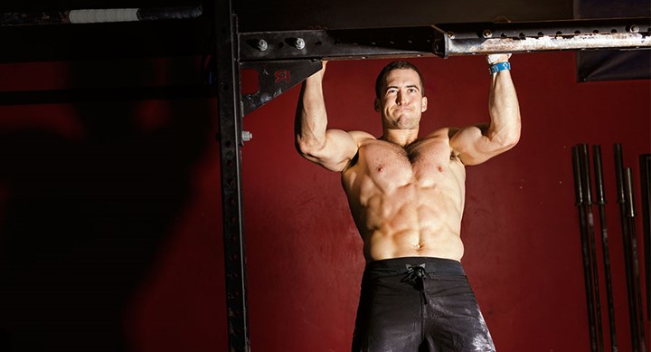 Ben Smith doing intense pull-ups while being shirtless