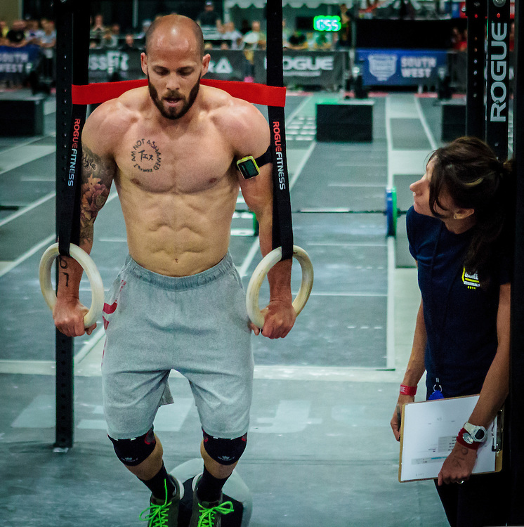 Chris Spealler doing ring exercises during a CrossFit competition