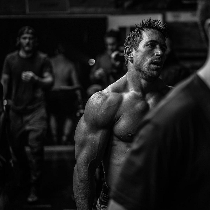 Dan Bailey being shirtless during a CossFit session, looking ripped and muscular