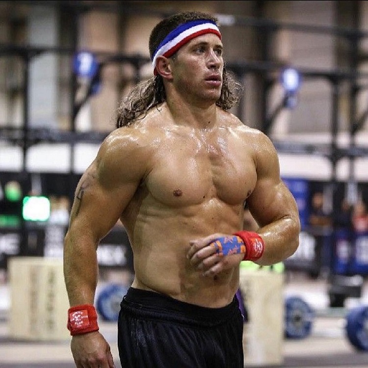 Dan Bailey standing shirtless during crossfit training, looking strong and lean